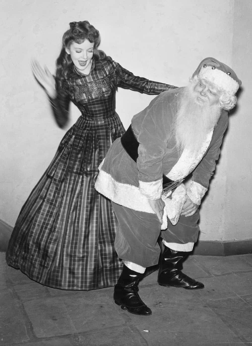 Ida Lupino Giving Santa A Birthday Spanking, 1942