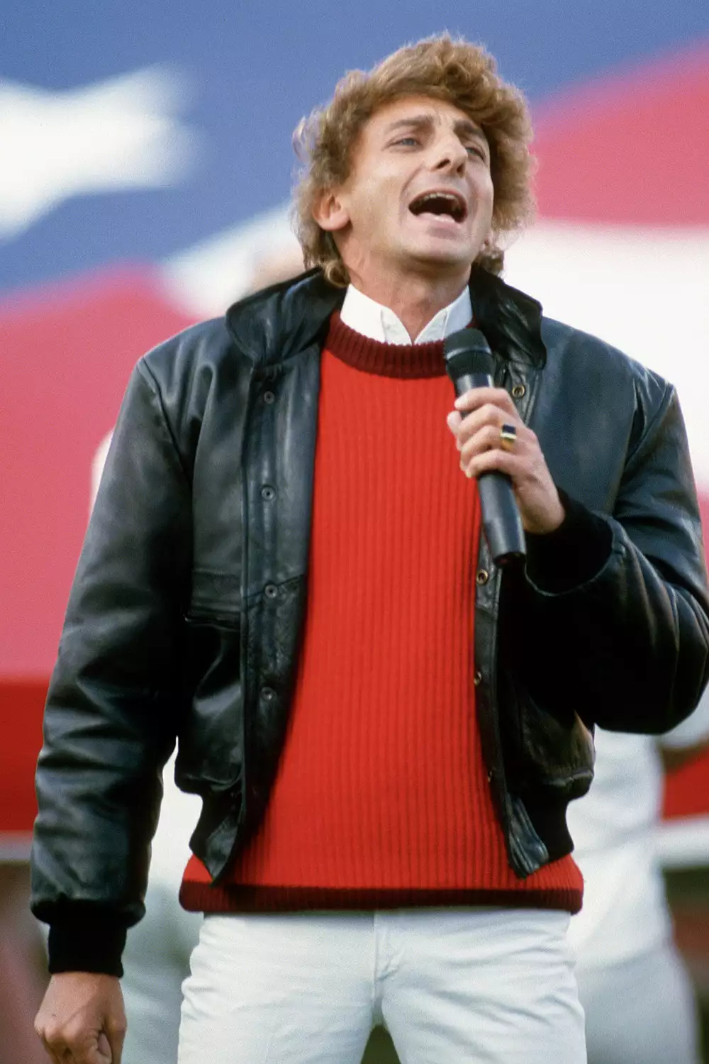 Barry Manilow performs the U.S. national anthem before Super Bowl XVIII at Tampa Stadium in Tampa, Fla., on Jan. 22, 1984