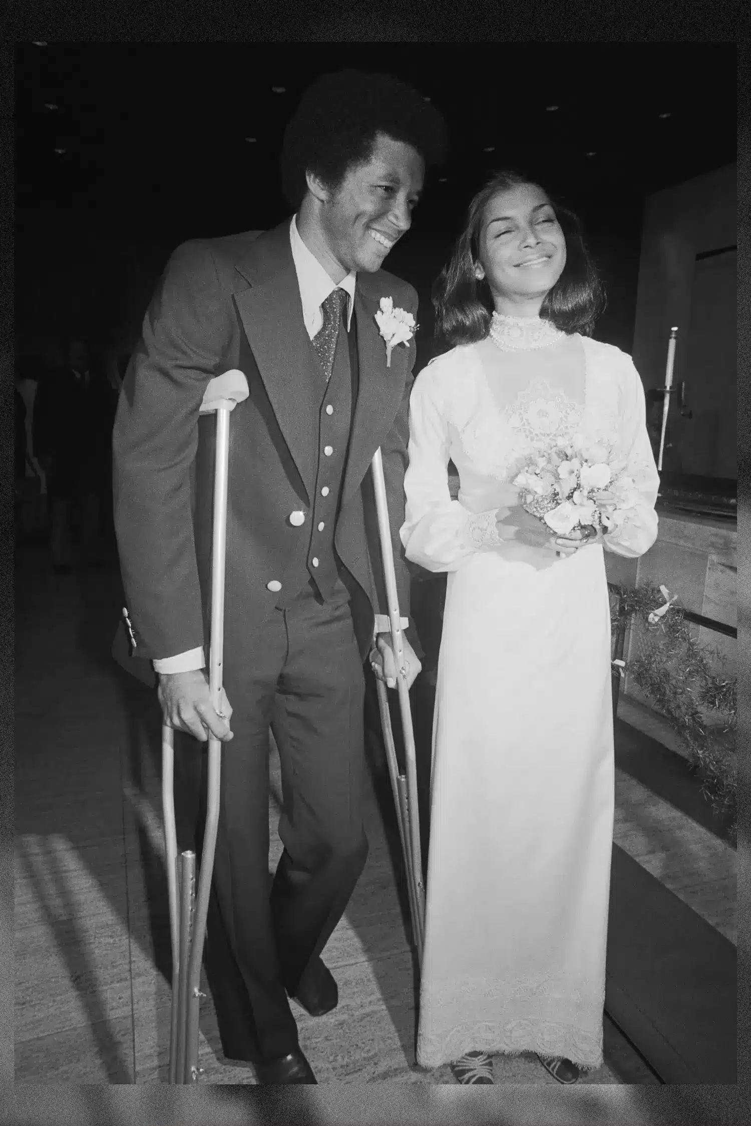 Arthur Ashe In Suit and Crutches and Jeanne Marie in Long Sleeve Wedding Dress